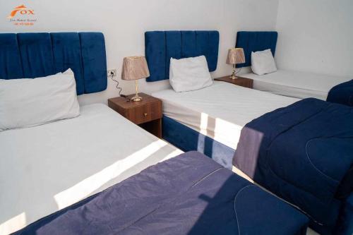 Postel nebo postele na pokoji v ubytování Fox Resort El Gouna