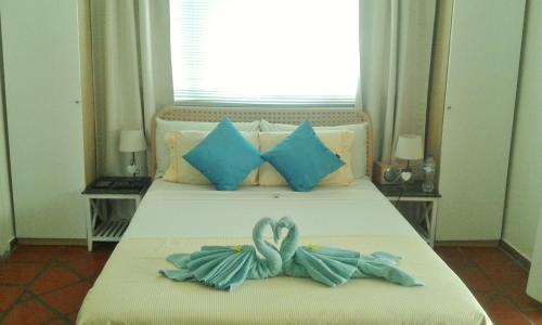 Ліжко або ліжка в номері Karibu Aruba Boutique Hotel