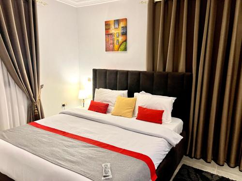 Postel nebo postele na pokoji v ubytování Karjel Homes Apartments