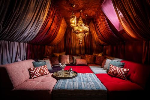 a living room with a couch and a table at Virgin Hotels Edinburgh in Edinburgh