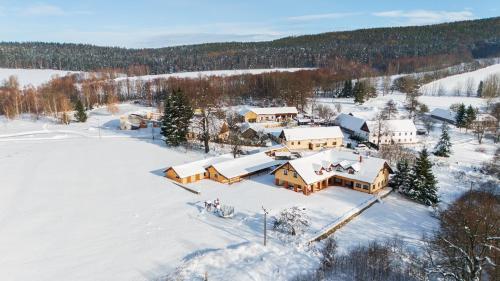 an aerial view of a house in the snow at Penzion Šejby in Horní Stropnice