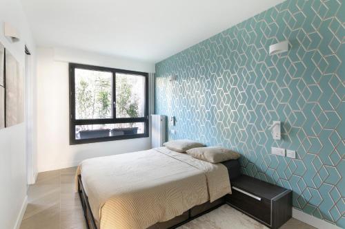 Ένα ή περισσότερα κρεβάτια σε δωμάτιο στο Loft 52m²+parking à 15 min de Paris centre