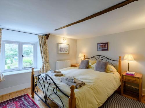 a bedroom with a large bed in a room at 3 Bed in Isle of Purbeck IC027 in Kingston