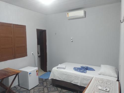 Postel nebo postele na pokoji v ubytování Casa de Família Coração Amazônico