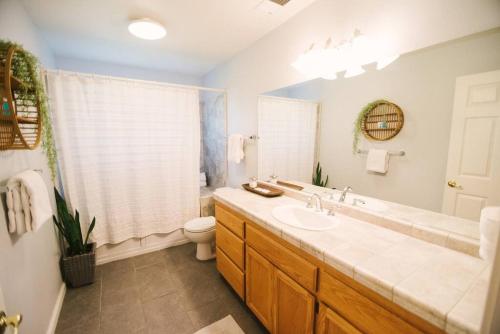 a bathroom with a sink and a toilet at Haymakers Inn - Peaceful Country Views in Paso Robles