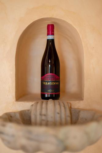 a bottle of wine sitting in a shelf at Castello Di Semivicoli in Casacanditella