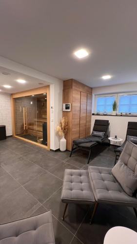 a living room with a couch and a table at Winkelschiffchen III mit Sauna in Juist
