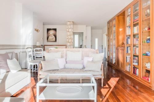 a living room with a couch and a table at Spacious, Air Conditioner, Few Minutes to the Castle in Malcesine