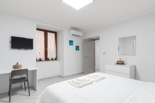 En eller flere senge i et værelse på Centro Storico - Appartamento comodo e tranquillo per 4 persone