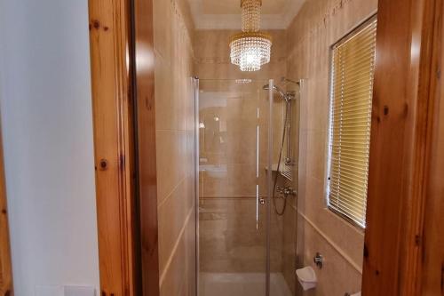 a bathroom with a shower with a glass shower stall at Ramla Boutique Home in Marsaskala