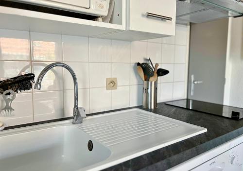 Køkken eller tekøkken på Duplex la Baleine Bleue