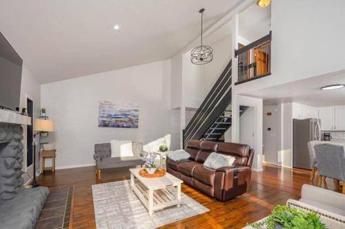 a living room with a couch and a table at Green Bay Cozy home, 3 bed rooms, 6 beds, 2 bath in Green Bay