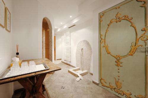 
a bathroom with a large mirror and a sink at Hotel Montana in Madonna di Campiglio
