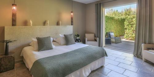 Katil atau katil-katil dalam bilik di Hôtel La Dimora & Spa