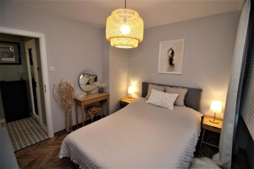 Postel nebo postele na pokoji v ubytování Apartament Kaszmirowy