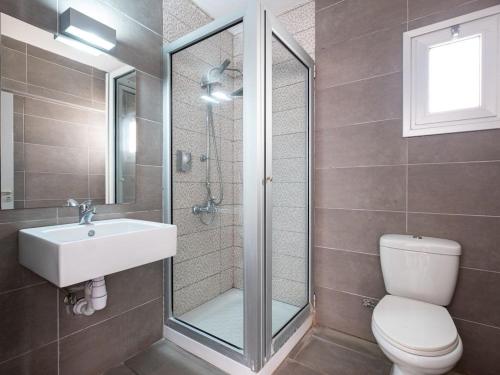 a bathroom with a toilet and a sink and a shower at Rio Gardens Aparthotel in Ayia Napa