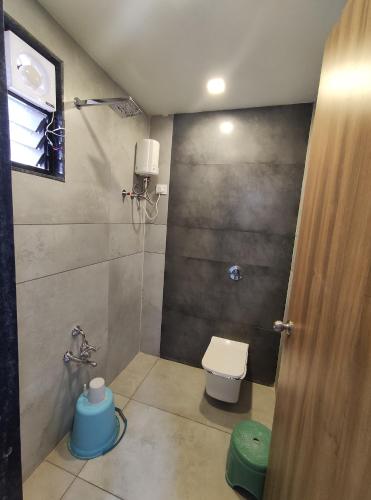 a bathroom with a toilet and a shower at HOTEL SHREE RAM in Rājpīpla