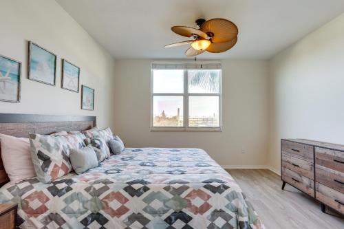 a bedroom with a bed and a ceiling fan at Lantana Condo with Smart TV 11 Mi to Palm Beach! in Lantana