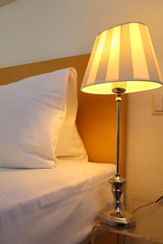 Katil atau katil-katil dalam bilik di Aparthotel Deutschmeister