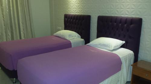 A bed or beds in a room at Hotel Ermis