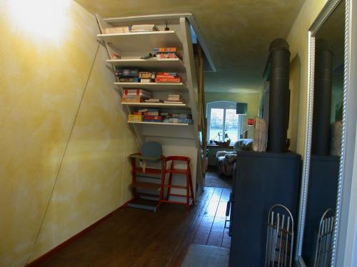 a room with a stairway with a book shelf at Erholen und Wohlfühlen Auf dem Knick in Detmold