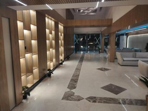 a lobby with couches and tables in a building at ميرا سويت للشقق المخدومة in Jeddah