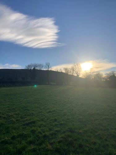 a cloud formation in the sky over a field at Mill Park Stay Room ONLY with use of kitchen & bathroom in Derry Londonderry