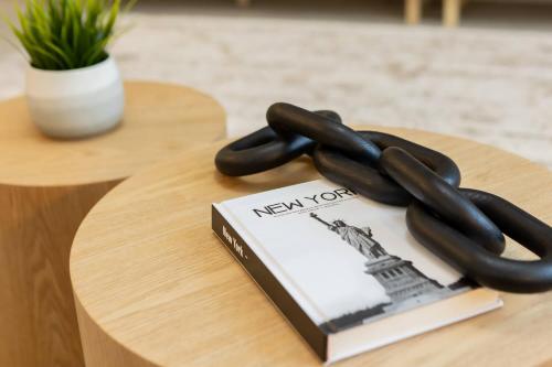 a book and a pair of tongos sitting on a table at Family 4BR w Private Pool near Disney Parks in Kissimmee