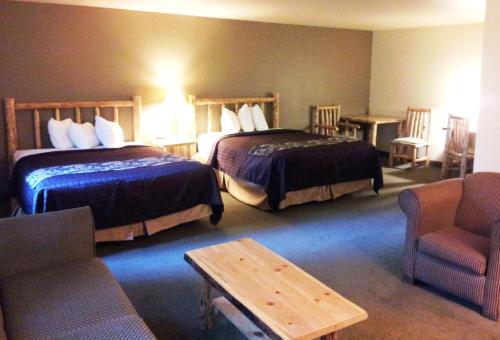 A bed or beds in a room at FairBridge Inn and Suites Sandpoint