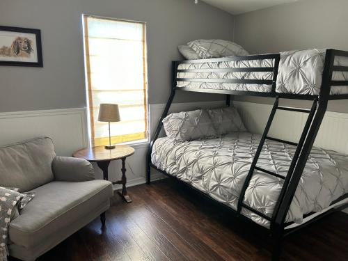 a living room with a bunk bed and a couch at Eastside Costa Mesa house in Costa Mesa