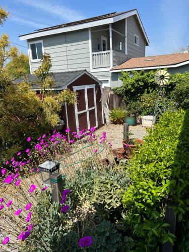 a house with a garden with purple flowers at Eastside Costa Mesa house in Costa Mesa