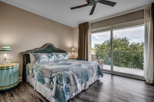 a bedroom with a bed and a large window at Marina Inn 5-305 in Myrtle Beach