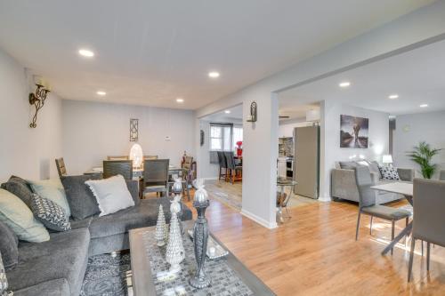 a living room with a couch and a table at Country Club Hills Home Walk to Rec Center! in Country Club Hills
