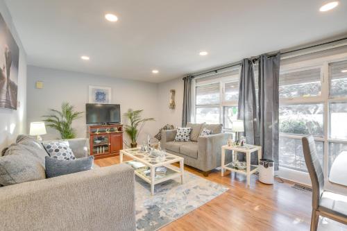 a living room with two couches and a tv at Country Club Hills Home Walk to Rec Center! in Country Club Hills