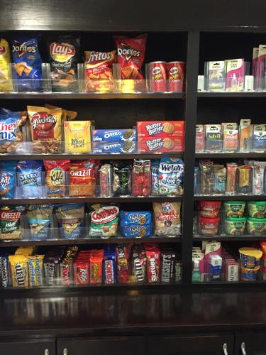 a shelf filled with lots of different types of food at Comfort Inn & Suites, White Settlement-Fort Worth West, TX in Fort Worth