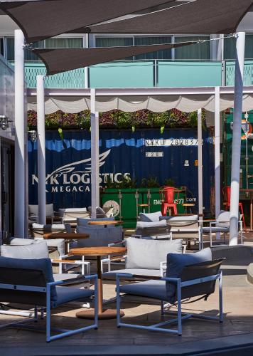 a group of chairs and tables on a patio at Hotel Zephyr San Francisco in San Francisco