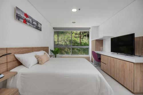 Postel nebo postele na pokoji v ubytování PORTANOVA Suites by ADVENTU