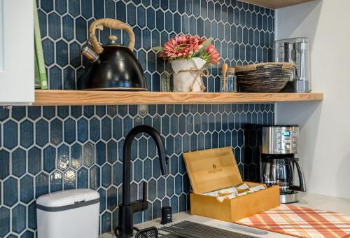 a kitchen counter with a sink with a box on it at Cozy Industrial Home in Ballard, Walk Score 95! in Seattle