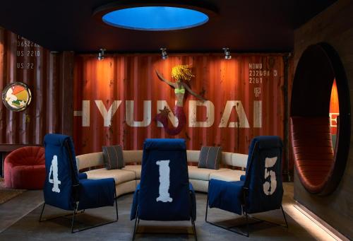 a living room with a couch and two chairs at Hotel Zephyr San Francisco in San Francisco