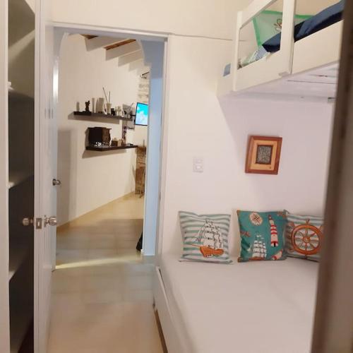 a room with a hallway with pillows on a wall at BLUE HOUSE OCEAN VIEW in Santa Bárbara de Samaná