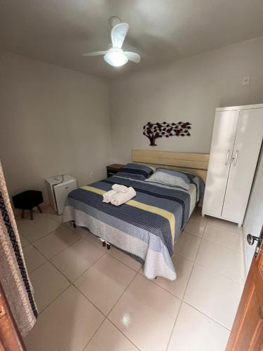 Ένα ή περισσότερα κρεβάτια σε δωμάτιο στο Hospedaria de Maria