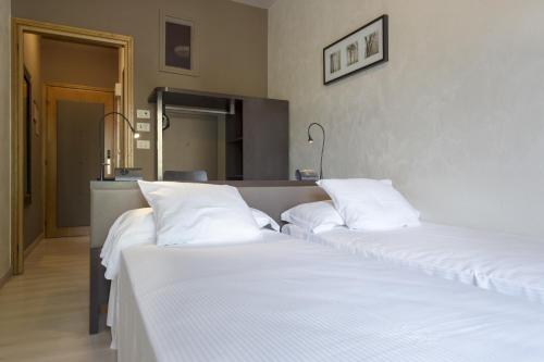 Llit o llits en una habitació de M14 Hotel & Spa
