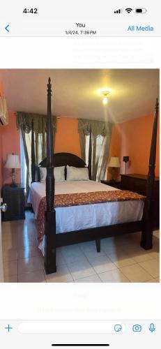 a bedroom with a large bed in a room at Luxury Villa rentals in Montego Bay