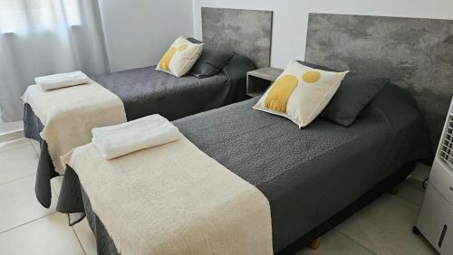 Postel nebo postele na pokoji v ubytování Complejo Hunter Plottier - Neuquén