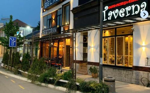 a store front of a building on a city street at Sunshine apartments - Valjevo in Valjevo