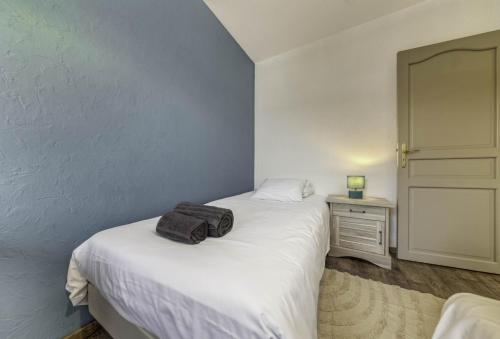 Ένα ή περισσότερα κρεβάτια σε δωμάτιο στο Appartement Les Oiseaux