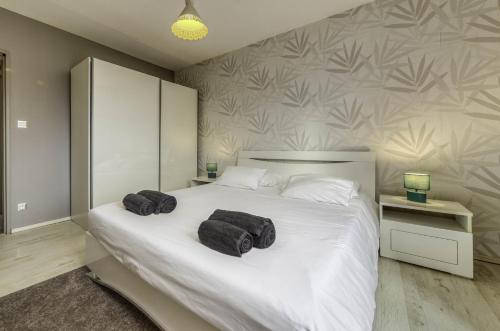 Ένα ή περισσότερα κρεβάτια σε δωμάτιο στο Appartement Les Oiseaux