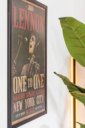 a poster of a woman with a microphone on a wall at Musicians Lounge - 2 BR with parking asssigned in Fort Lauderdale