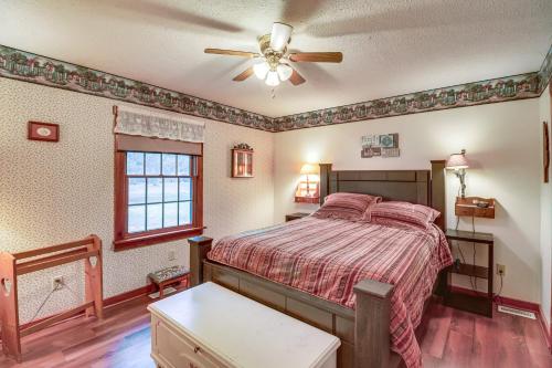 a bedroom with a bed and a ceiling fan at Charming Newark Home Less Than 10 Mi to Buckeye Lake in Newark