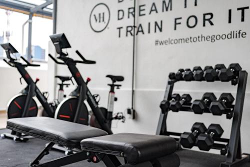 a gym with two exercise bikes in a room at Mariano Escobedo Apartments by VH in Mexico City